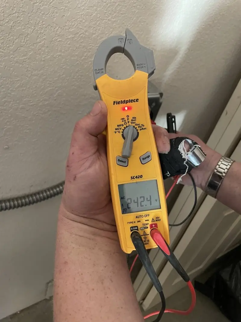Voltage testing with clamp meter during Electrical Installation Services in Mount Horeb